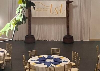 Foundation banquet arch and tables before event starts